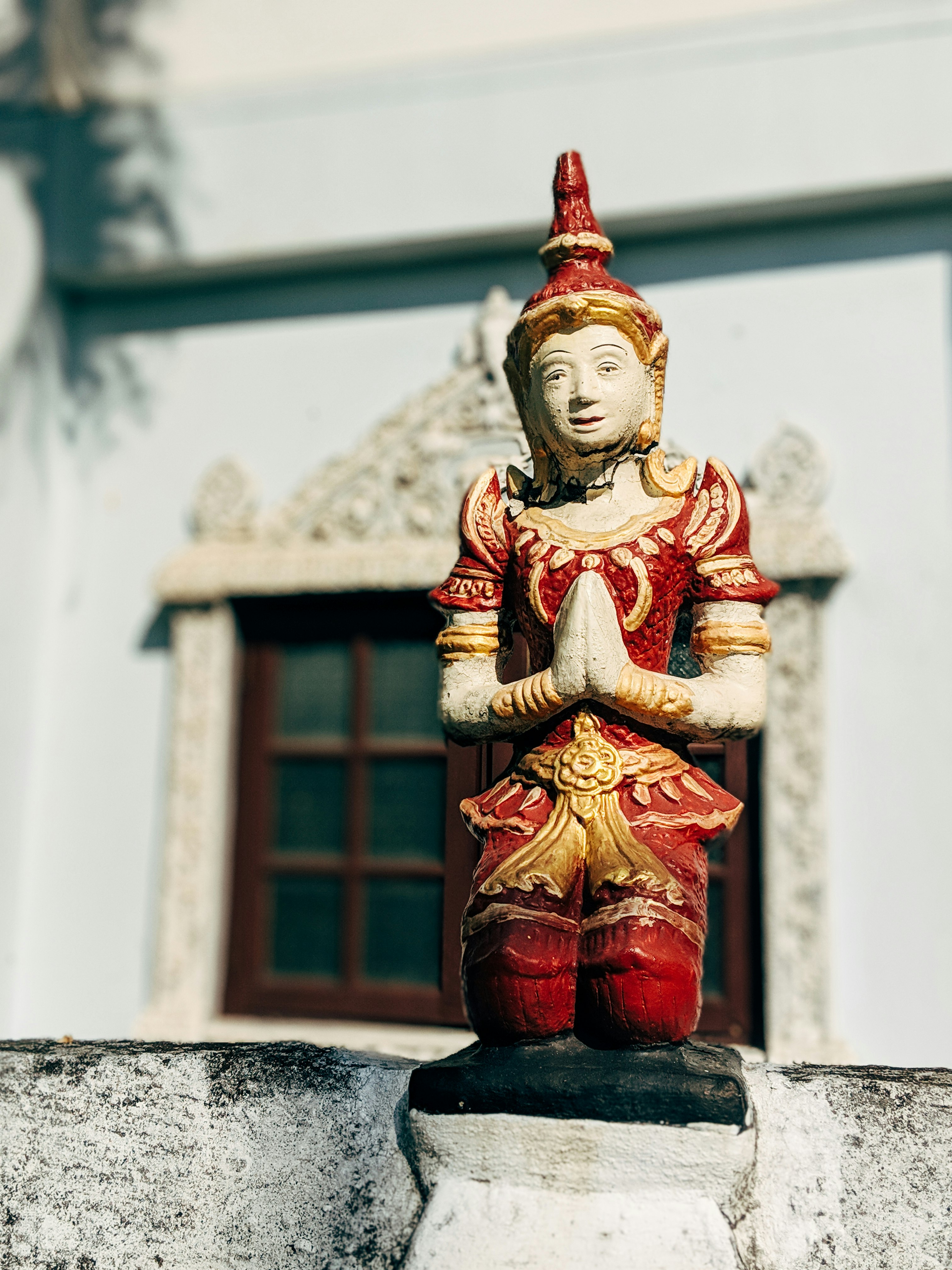 gold and red hindu deity figurine